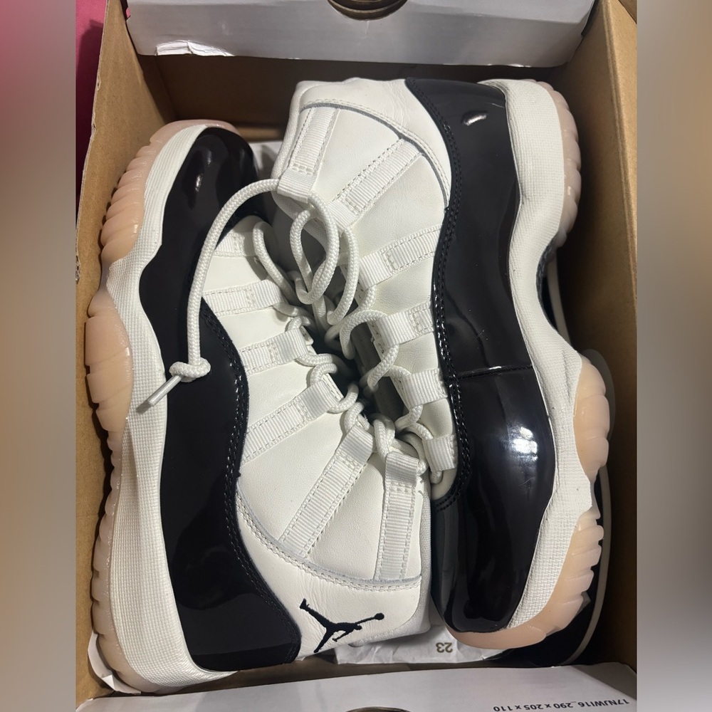 white, brown and pink jordan 11’s